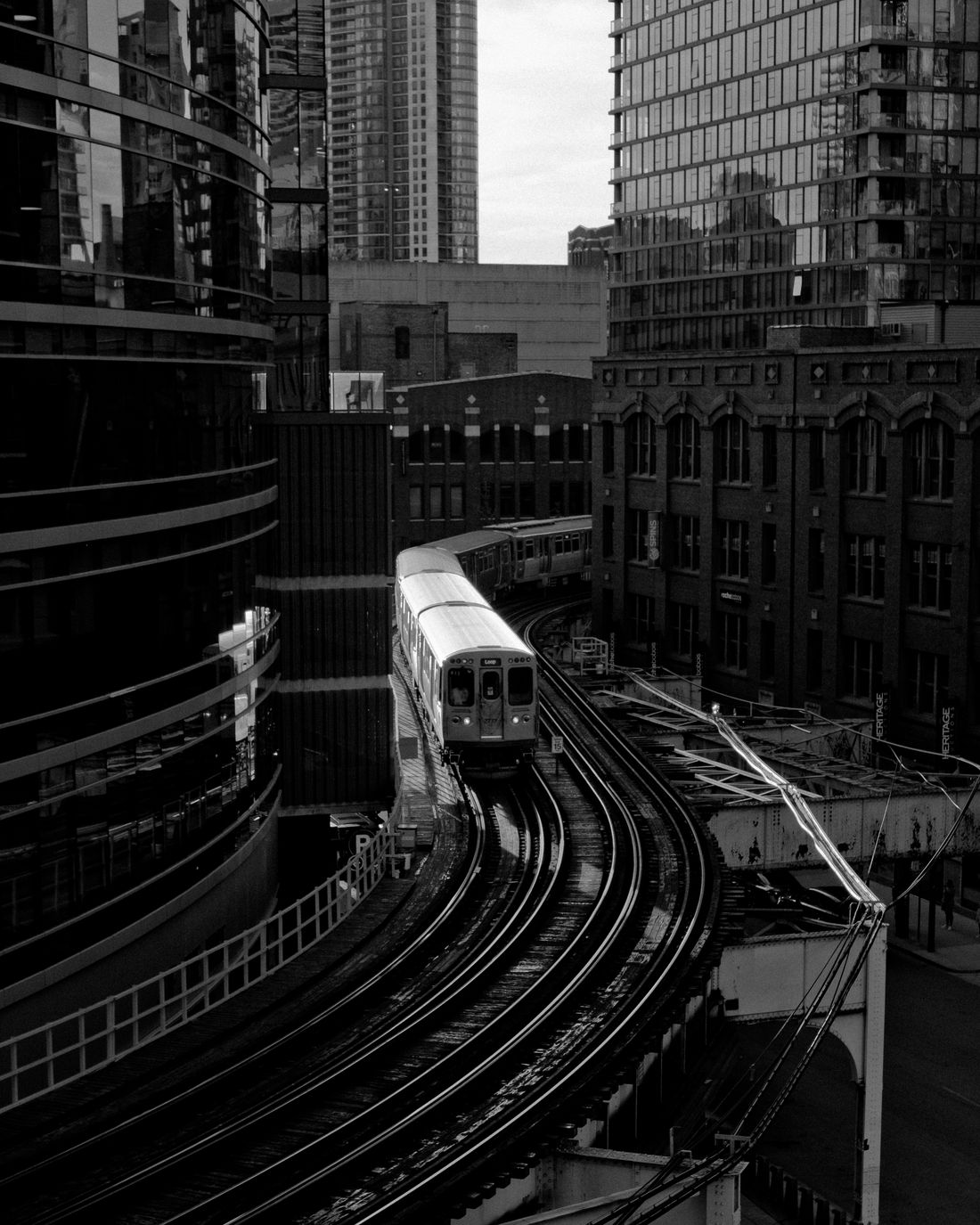 An elevated train moving through downtown Chicago.