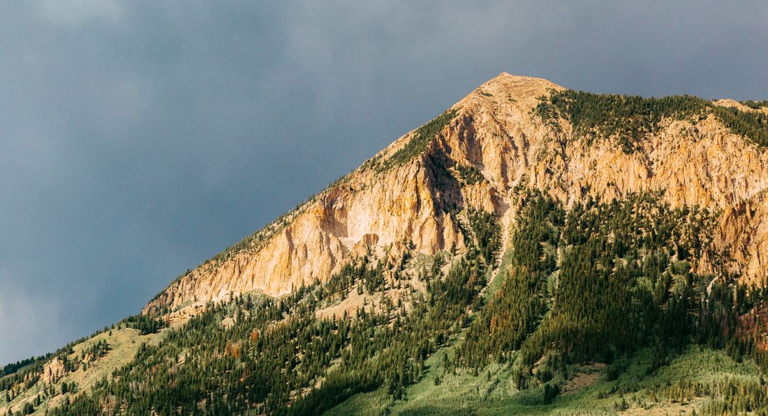 A mountain peak and trees at Crested Butte, Colorado.
